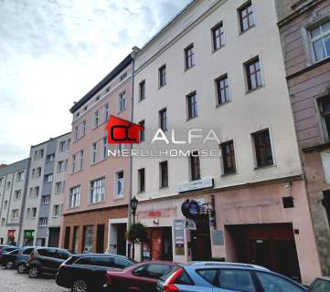Lokal w eleganckiej kamienicy w centrum miasta.