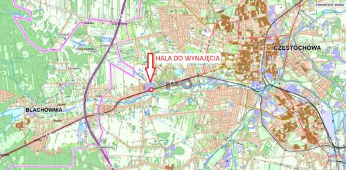 Murowana hala z rampą przy drodze głównej