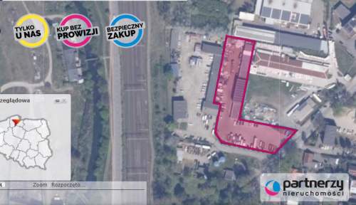 Działka przemysłowa z budynkami i dużym parkingiem