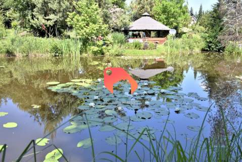 DZIAŁKA BUDOWLANA Z PIĘKNYM OGRODEM I STAWAMI 