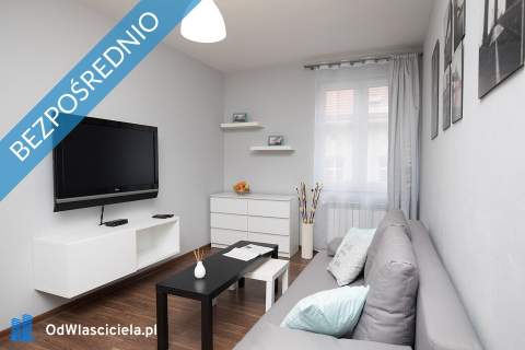 Kamienicę z apartamentami oraz częścią zorganizowanego prz
