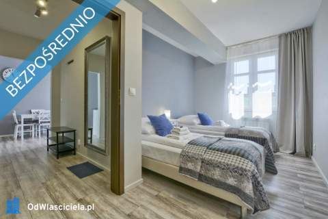 Kamienicę z apartamentami oraz częścią zorganizowanego prz