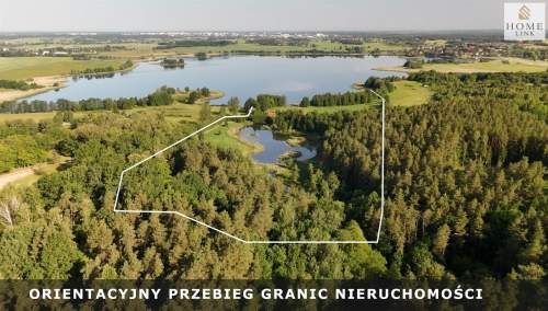 Działka nad jeziorem z lasem, stawem i domem