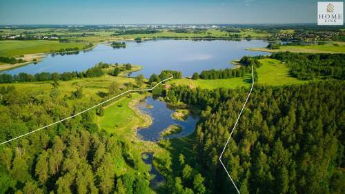 Działka nad jeziorem z lasem, stawem i domem