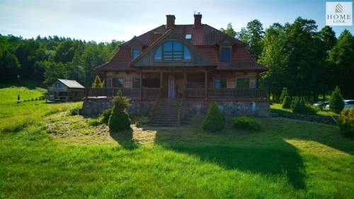 Olsztyn, dom z bala z linią brzegową