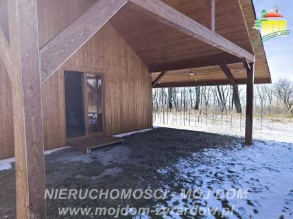 Ładna działka z nowym domkiem drewnianym, całorocznym.