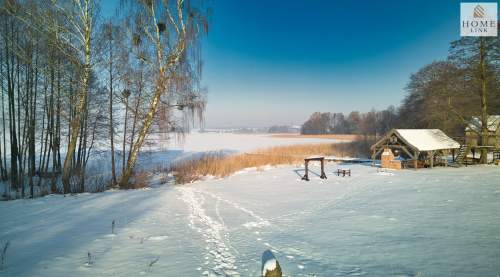 Olsztyn, dom z bala z linią brzegową