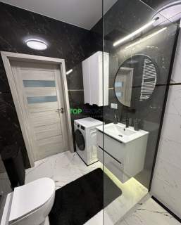 Nowoczesny salon z aneksem i sypialnia, garaż