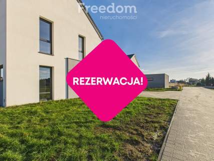 Nowoczesny dom z garażem i ogrodem.