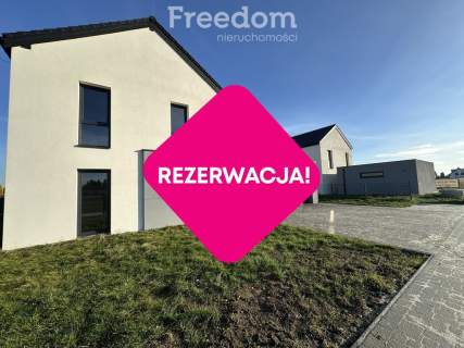 Nowoczesny dom z garażem i ogrodem.