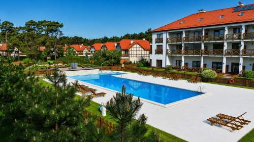 Dom sąsiadujący z plażą na osiedlu rezydencyjnym