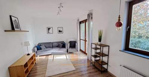 Apartament 2-pokoje z ogródkiem, komórką i garażem
