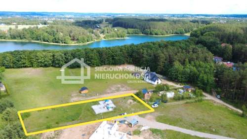 Działka z rozpoczętą budową 130 m od jeziora.