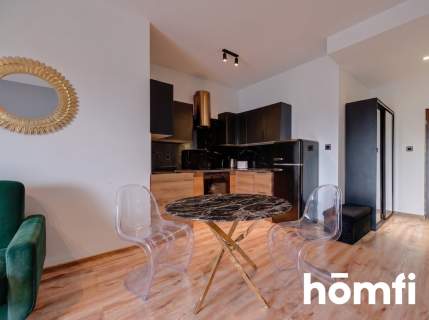 PRZESTRONNA KAWALERKA W APARTAMENTOWCU