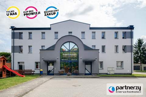 Budynek z przedszkolem i żłobkiem. 19 garaży.
