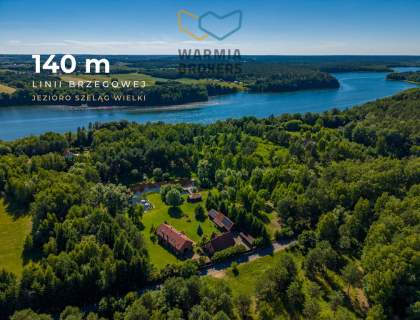 Dwa domy, z linią brzegową, nad jez. Szeląg Wielki