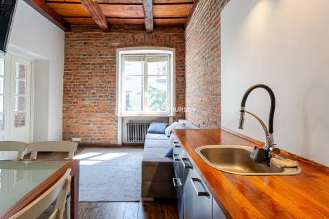 Dwupokojowy apartament z historycznym charakterem