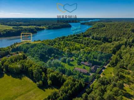 Dwa domy, z linią brzegową, nad jez. Szeląg Wielki