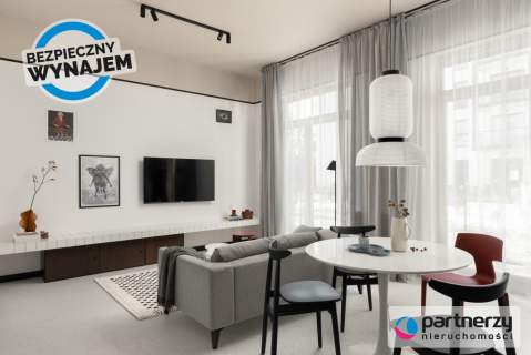 Designerskie mieszkanie z ogrókiem i halą garażową