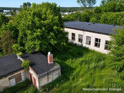 Działka z budynkiem biurowym w centrum Przedborza