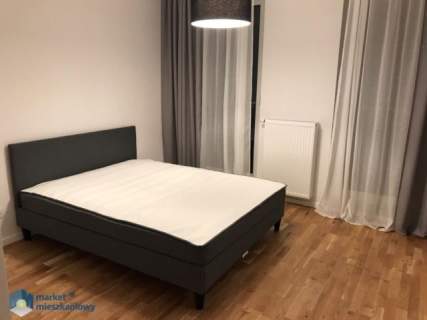 Dwa pokoje z garażem i komórką w apartamentowcu