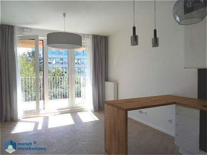 Dwa pokoje z garażem i komórką w apartamentowcu