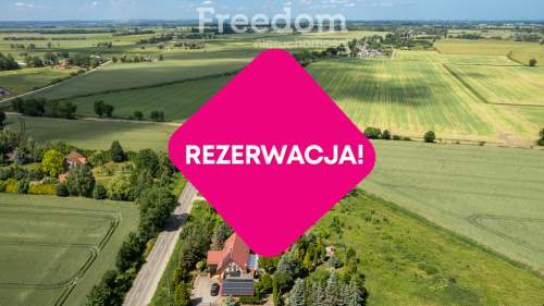 Działka z projektem domu i budynku z wiatą 