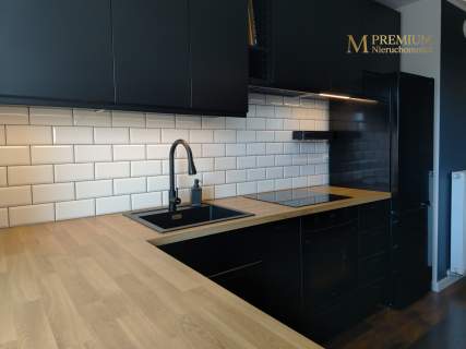 Salon z aneksem kuchennym balkon 2 miejsca postojowe