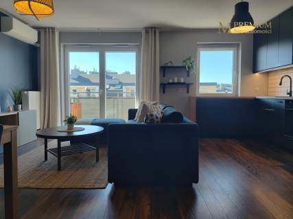 Salon z aneksem kuchennym balkon 2 miejsca postojowe