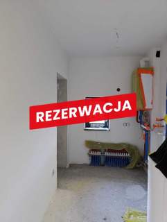 Nowy dom parterowy z antresolą.